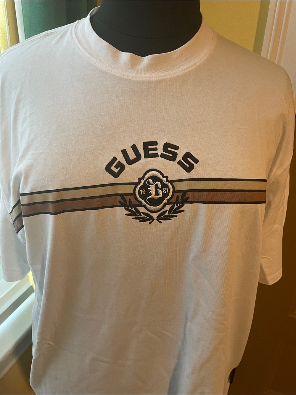 Guess White Short Sleeve Tee with Brown and Black Stripe Crest